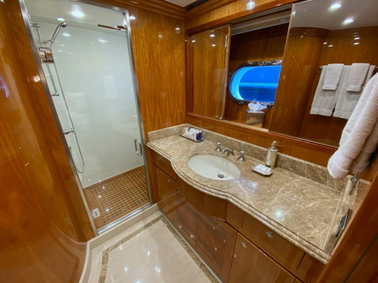 a bathroom with a countertop sink and a mirror aboard BRANDI WINE Yacht for Sale