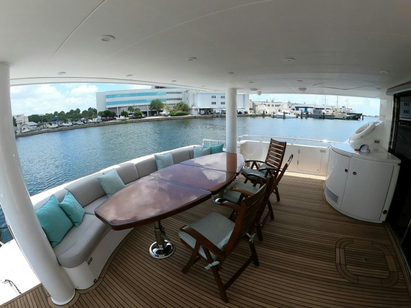 a room with a table chairs and a large window aboard BRANDI WINE Yacht for Sale