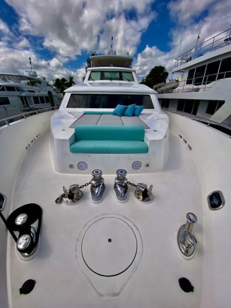 a white car with a green roof and a white car parked on a sunny day aboard BRANDI WINE Yacht for Sale