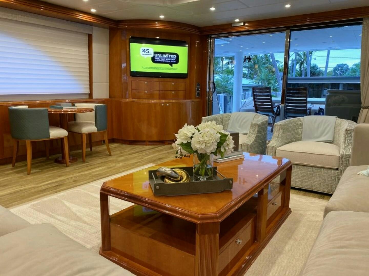 a living room with a table and chairs aboard BRANDI WINE Yacht for Sale