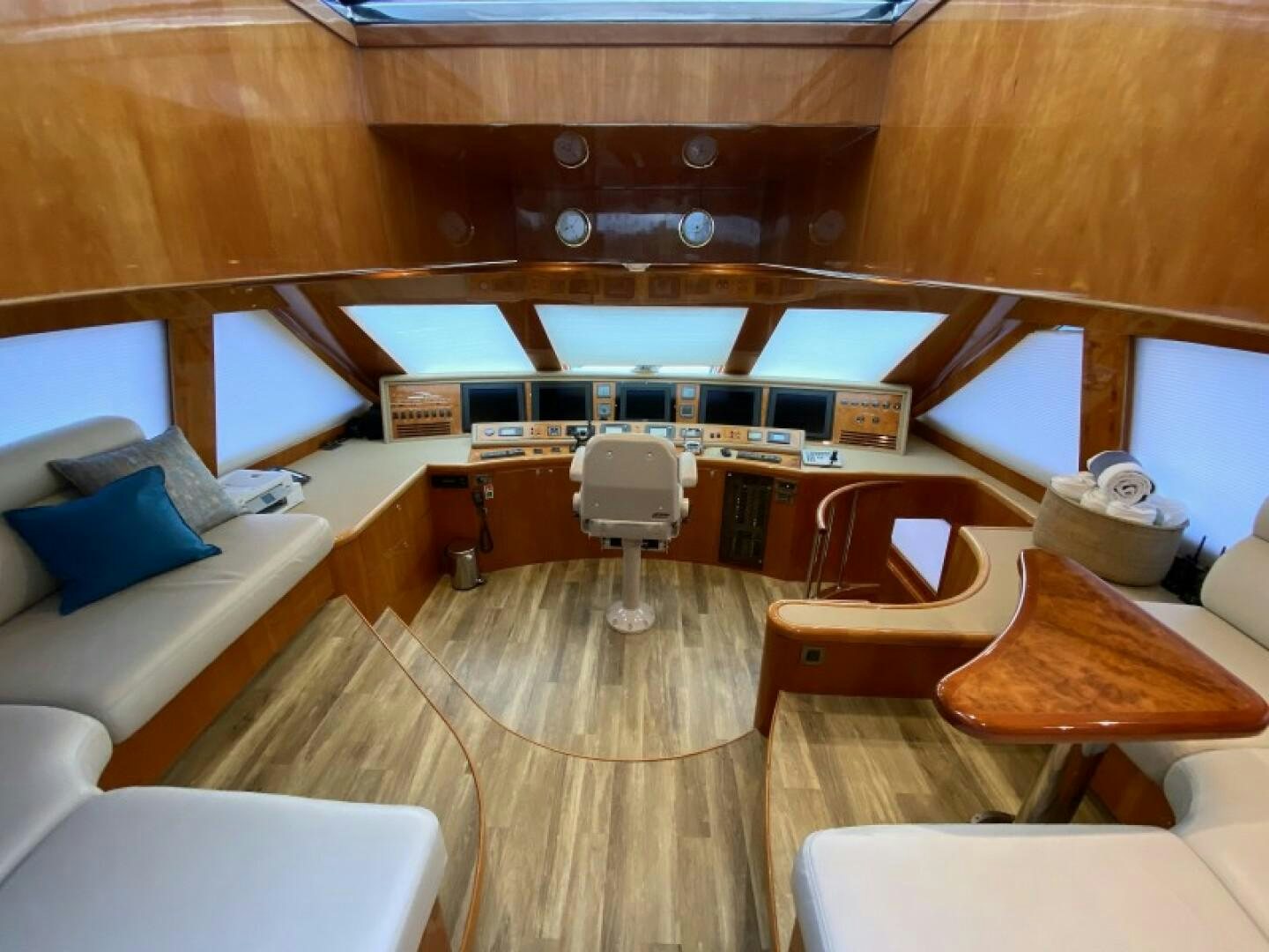 a room with a wood floor and a chair and a desk with a computer on it aboard BRANDI WINE Yacht for Sale