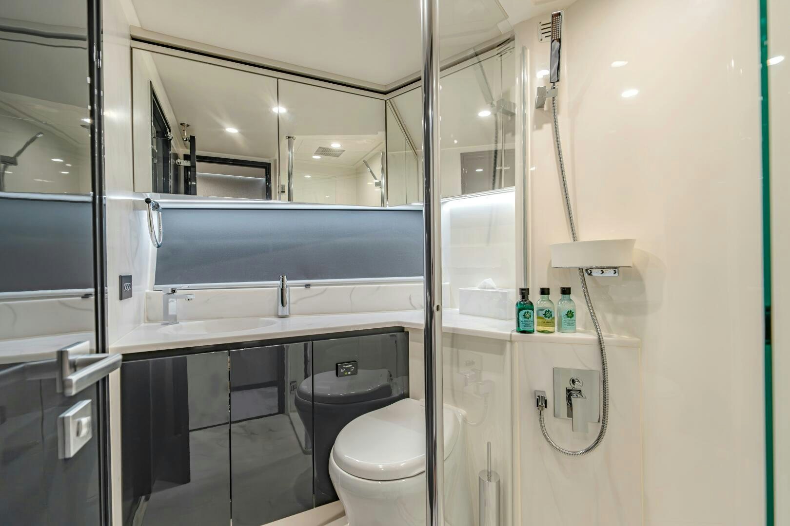 a bathroom with a glass shower aboard BIG MAMA Yacht for Sale