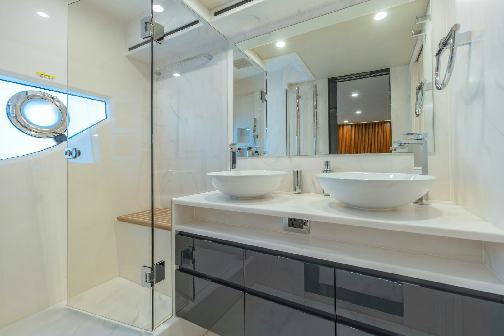 a bathroom with sinks and mirrors aboard BIG MAMA Yacht for Sale
