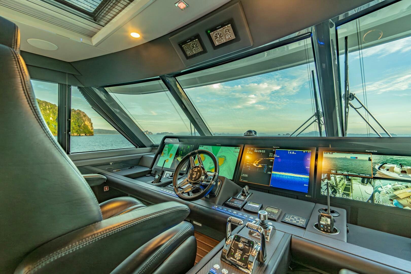 inside of a car with monitors and computers aboard BIG MAMA Yacht for Sale