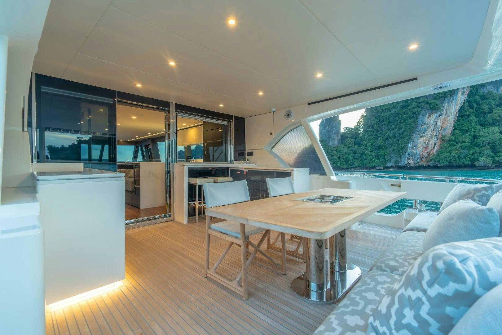 a room with a table and chairs aboard BIG MAMA Yacht for Sale