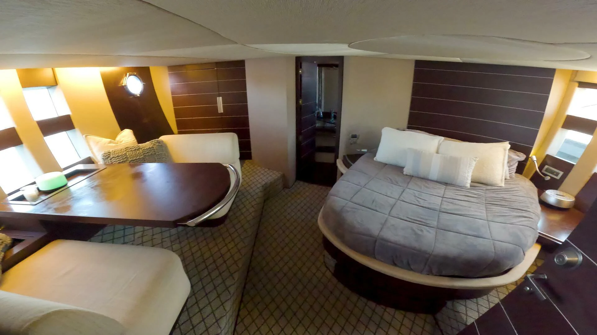a hotel room with a bed and a table aboard BOAT Yacht for Sale
