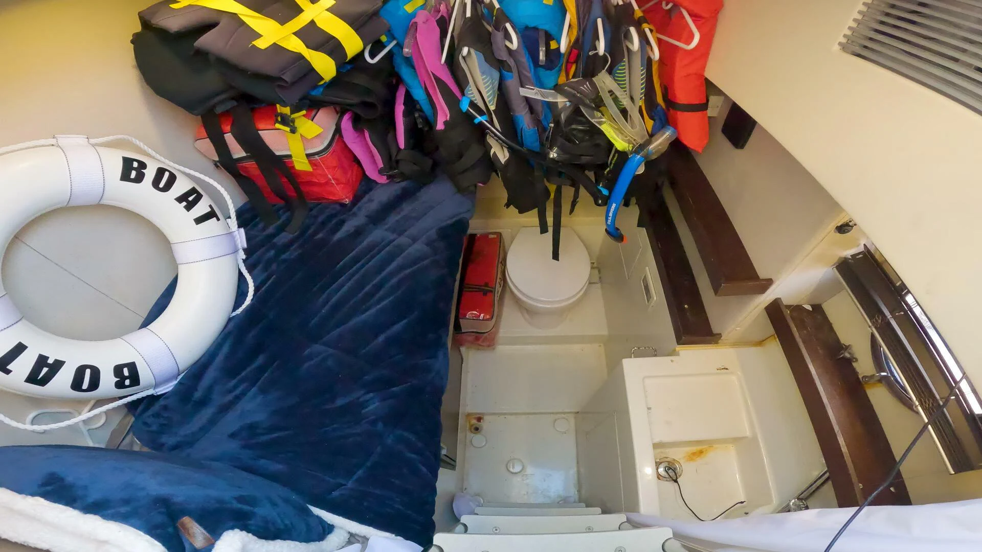 a closet full of clothes and shoes aboard BOAT Yacht for Sale