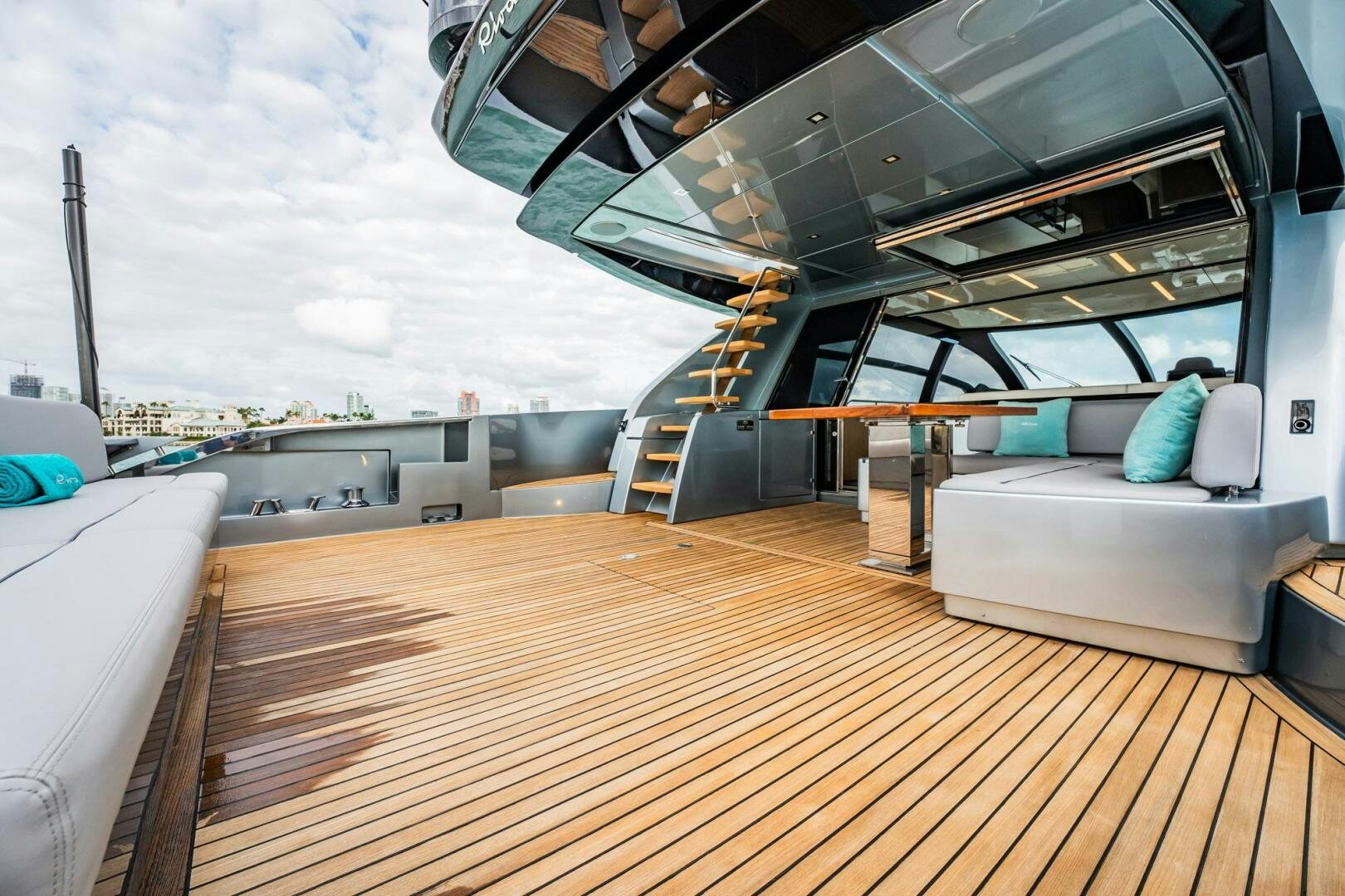 a room with a couch and a large window aboard RECREATIONAL USE Yacht for Sale