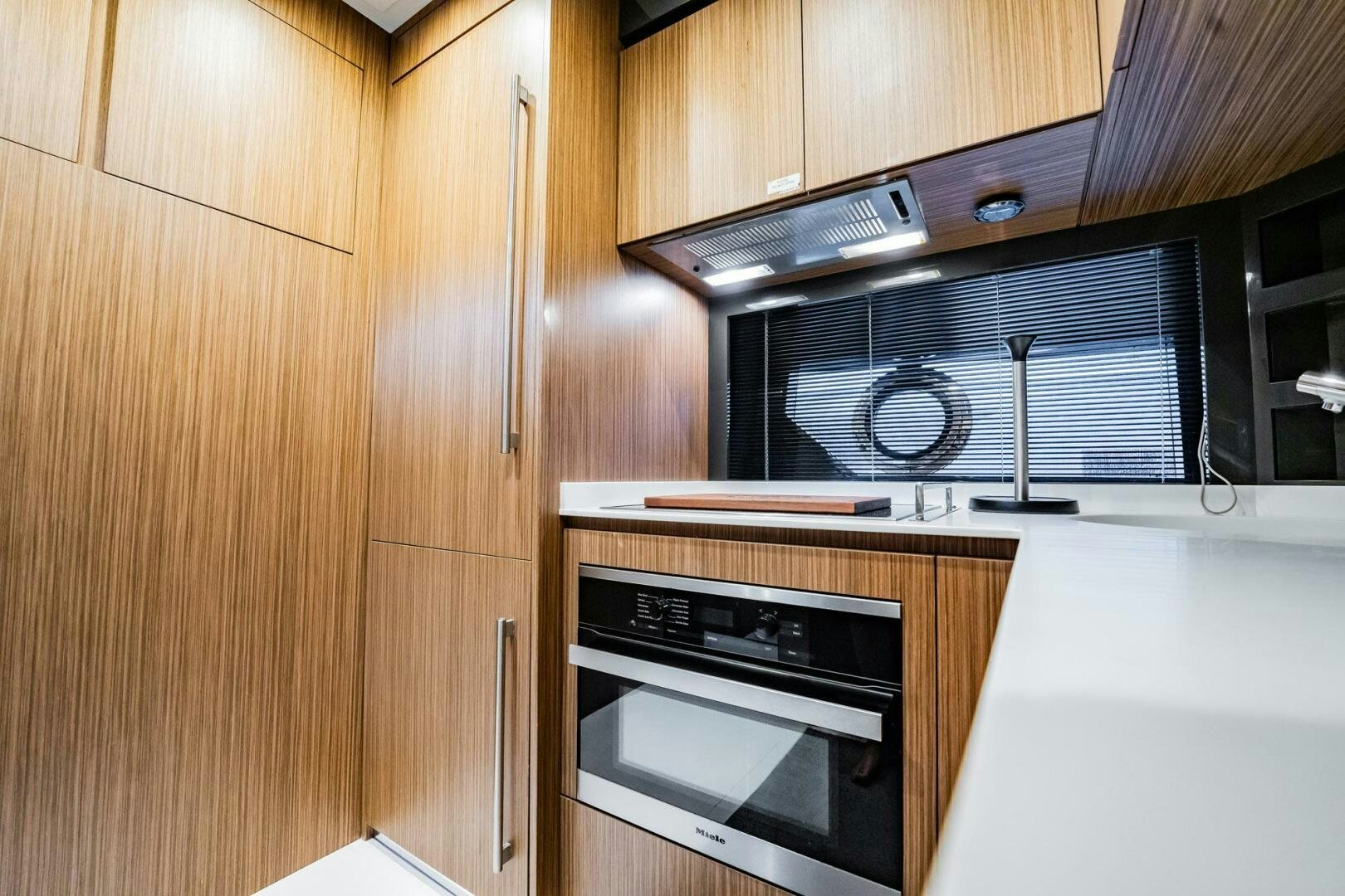 a microwave oven and oven in a kitchen aboard RECREATIONAL USE Yacht for Sale