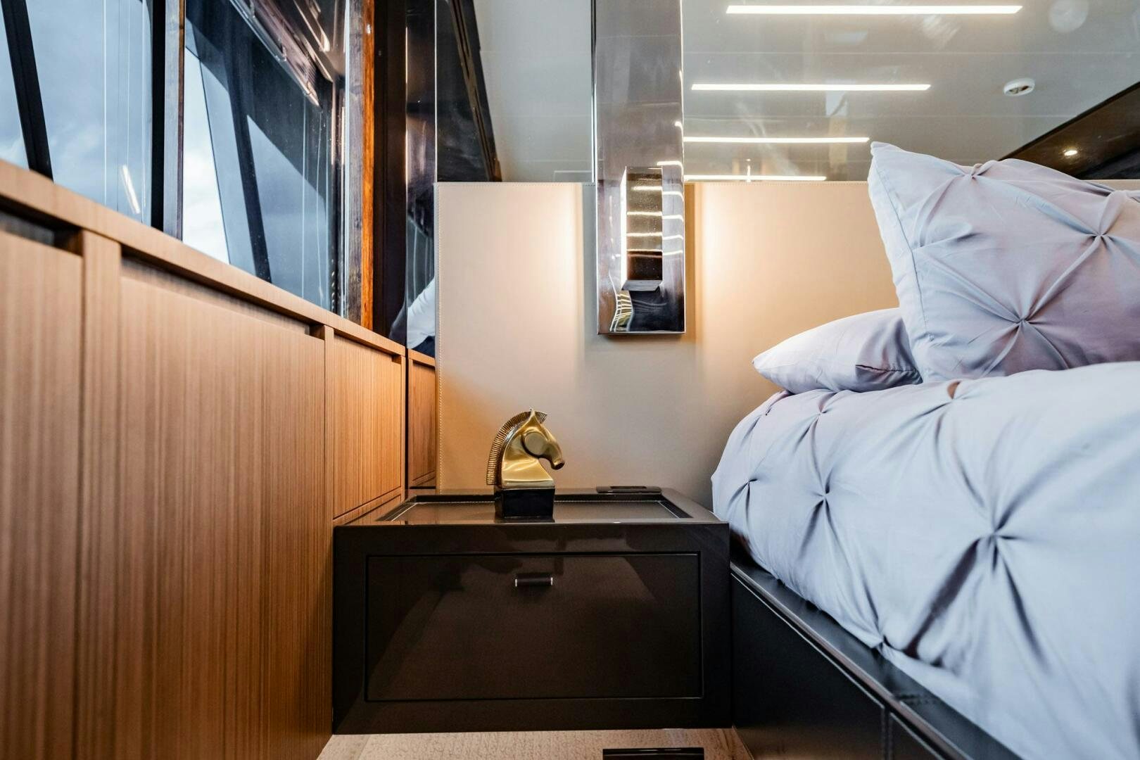 a bed and a desk in a room aboard RECREATIONAL USE Yacht for Sale