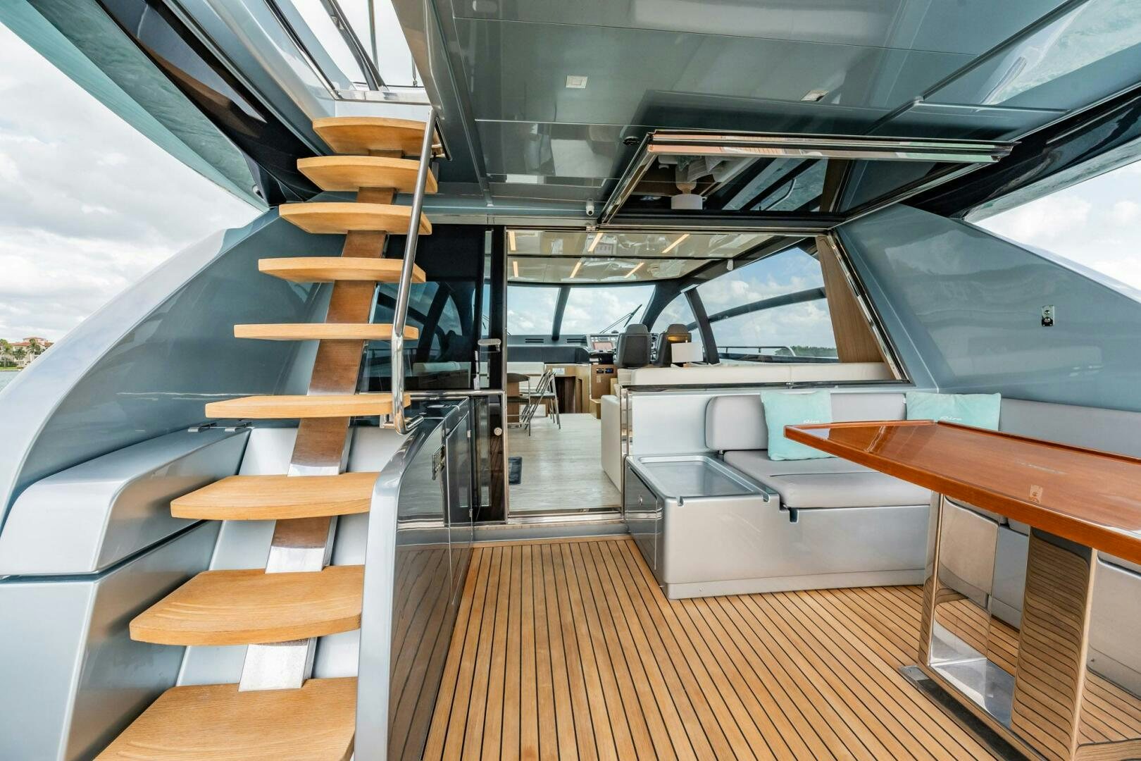 a room with wooden floors and a wood staircase aboard RECREATIONAL USE Yacht for Sale