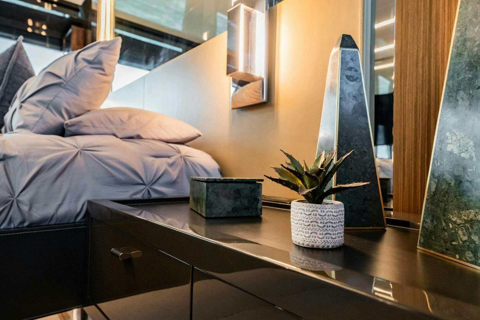 a desk with a plant on it aboard RECREATIONAL USE Yacht for Sale