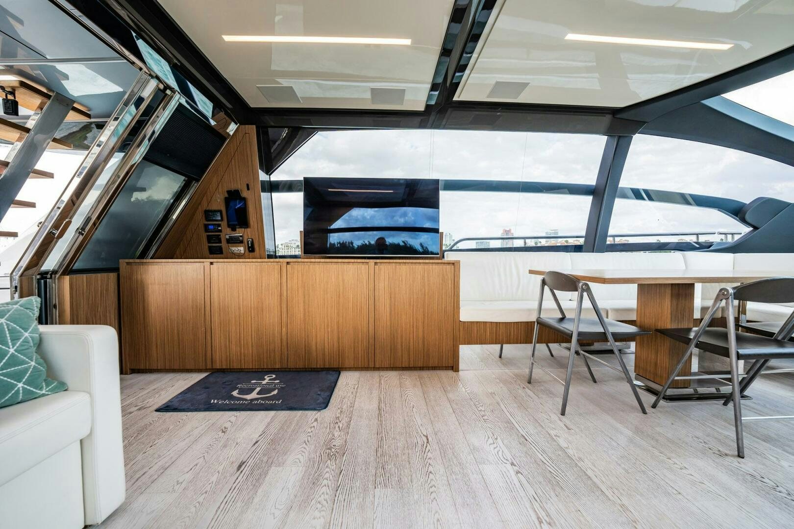 a room with a table and chairs aboard RECREATIONAL USE Yacht for Sale