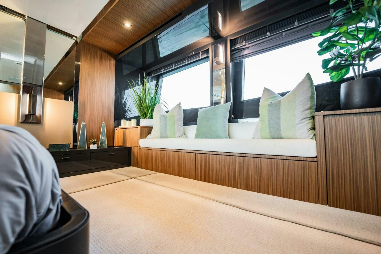 a room with a couch and a table and a plant aboard RECREATIONAL USE Yacht for Sale