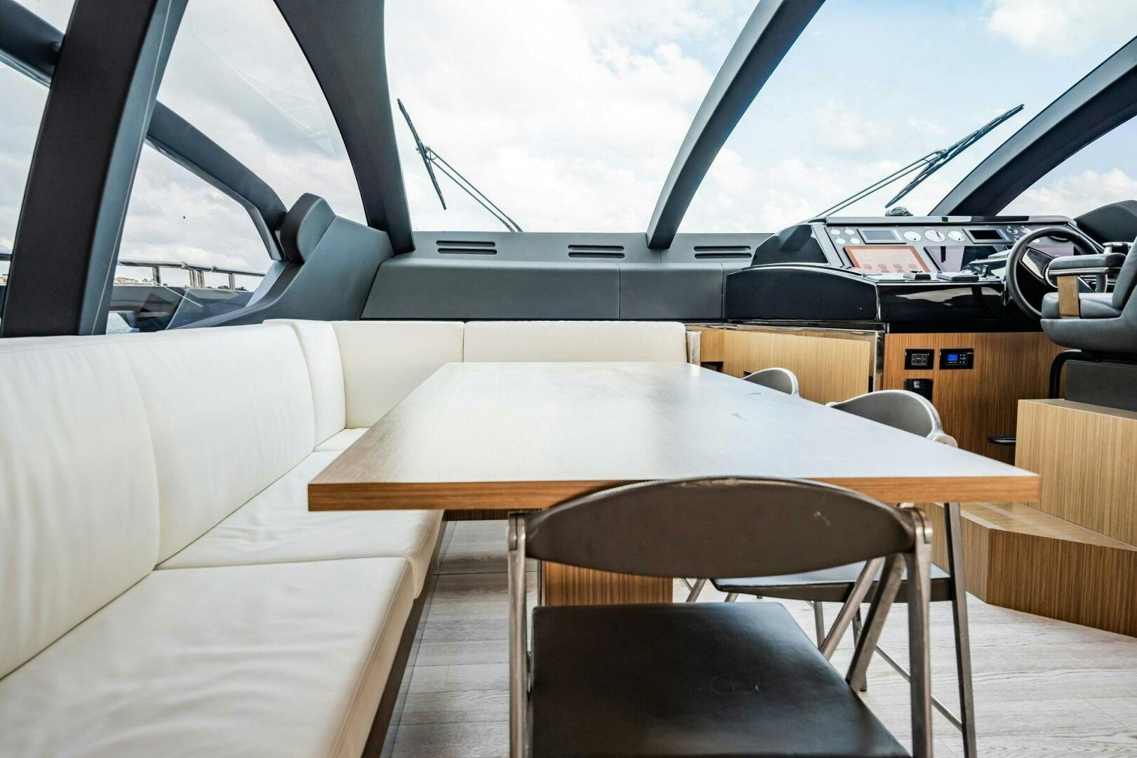 a table and chairs in a room aboard RECREATIONAL USE Yacht for Sale