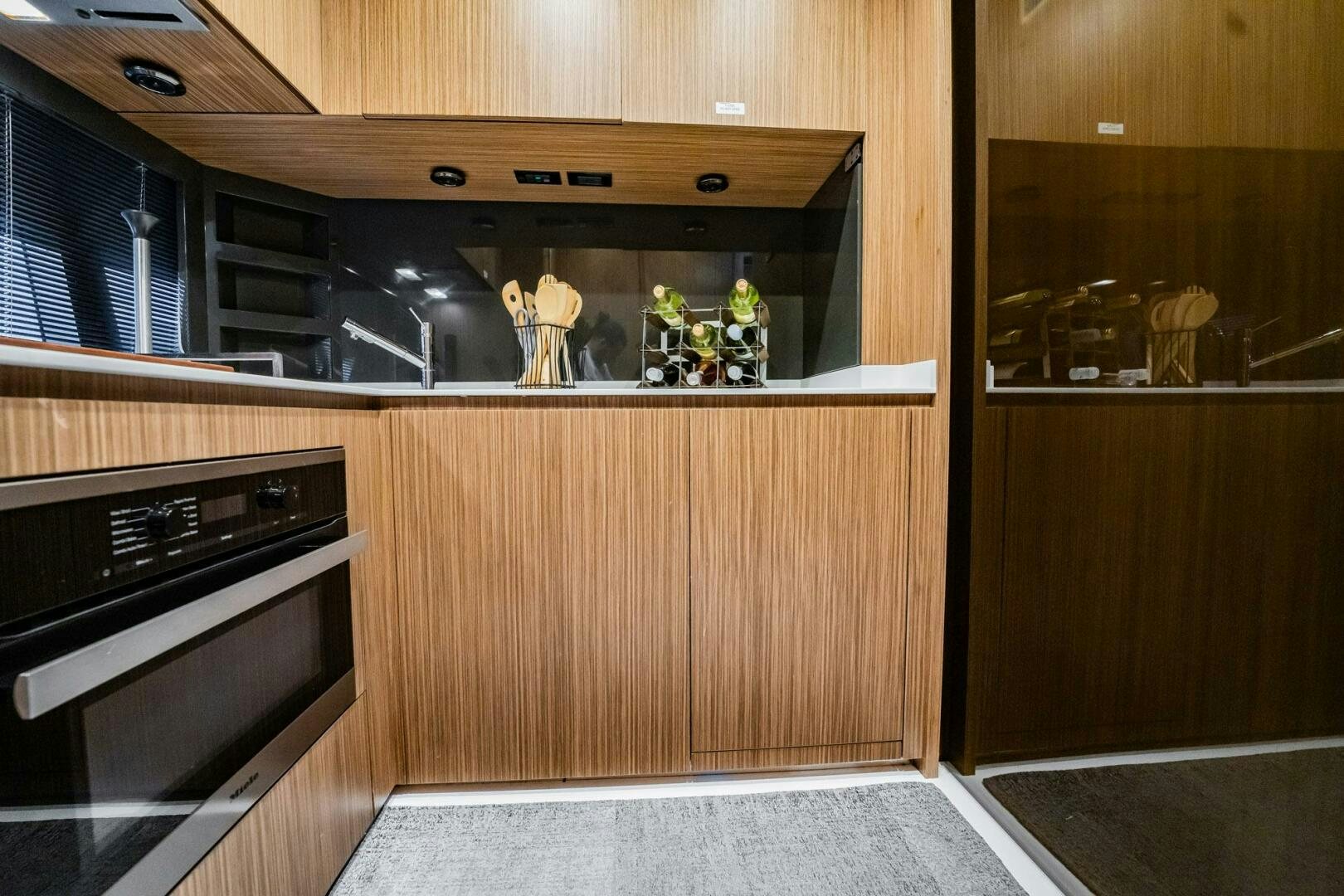 a kitchen with wooden cabinets aboard RECREATIONAL USE Yacht for Sale