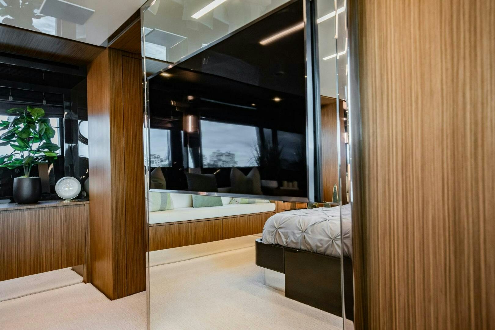 a room with a bed and a large mirror aboard RECREATIONAL USE Yacht for Sale