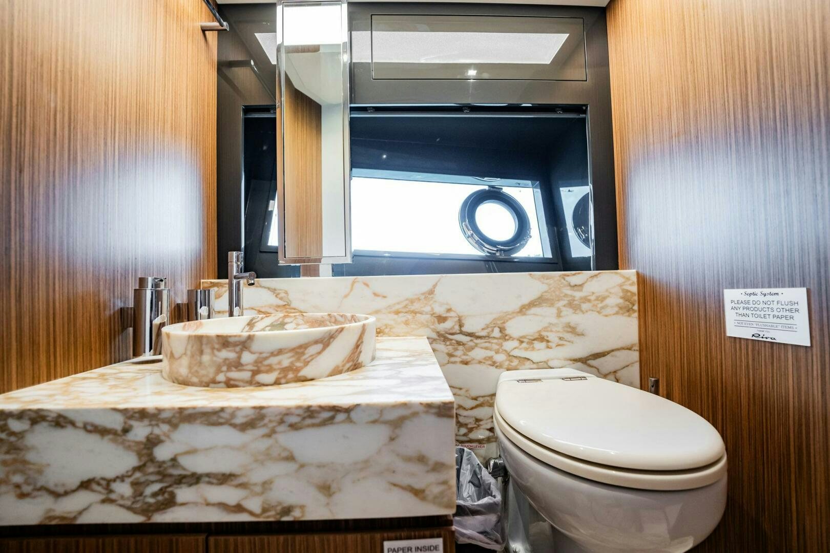 a bathroom with a sink and a toilet aboard RECREATIONAL USE Yacht for Sale