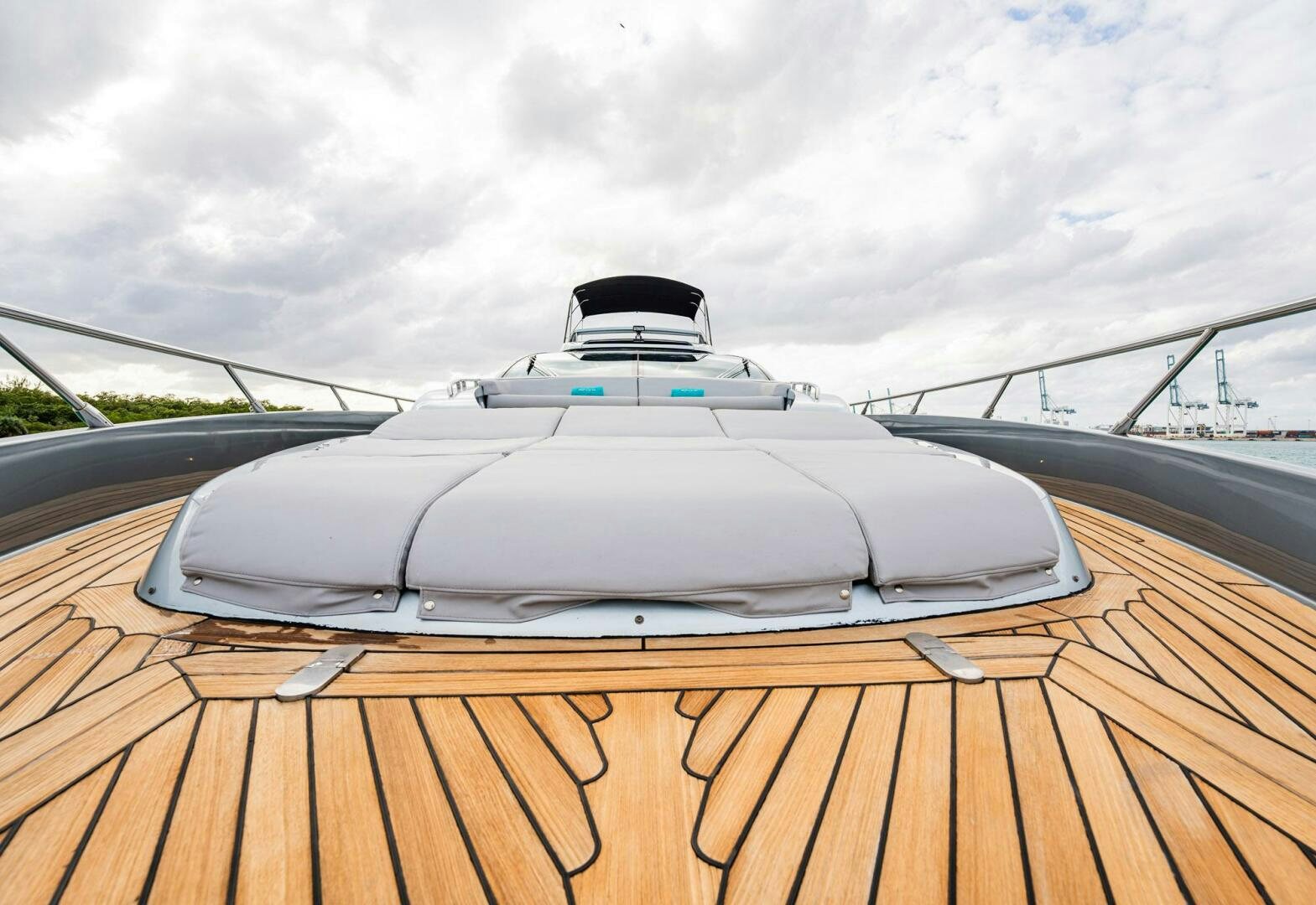 a white sports car on a wooden deck aboard RECREATIONAL USE Yacht for Sale