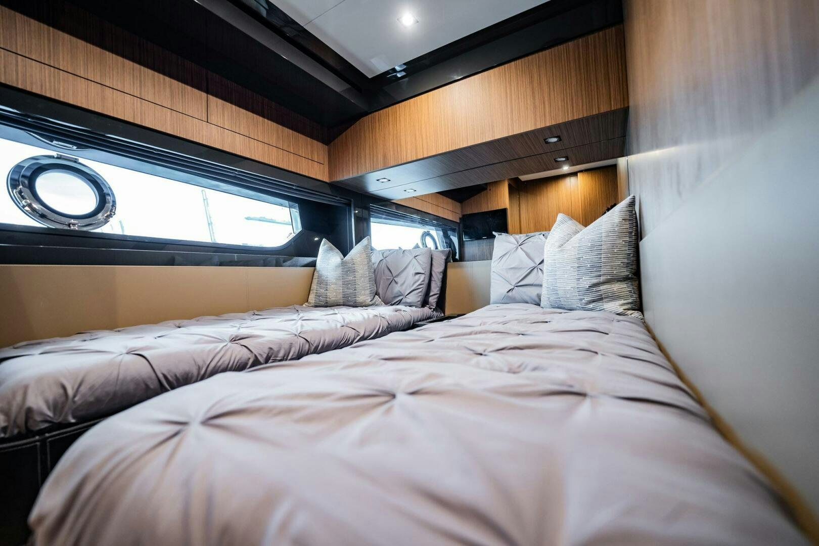 a bed with a bed and a window aboard RECREATIONAL USE Yacht for Sale