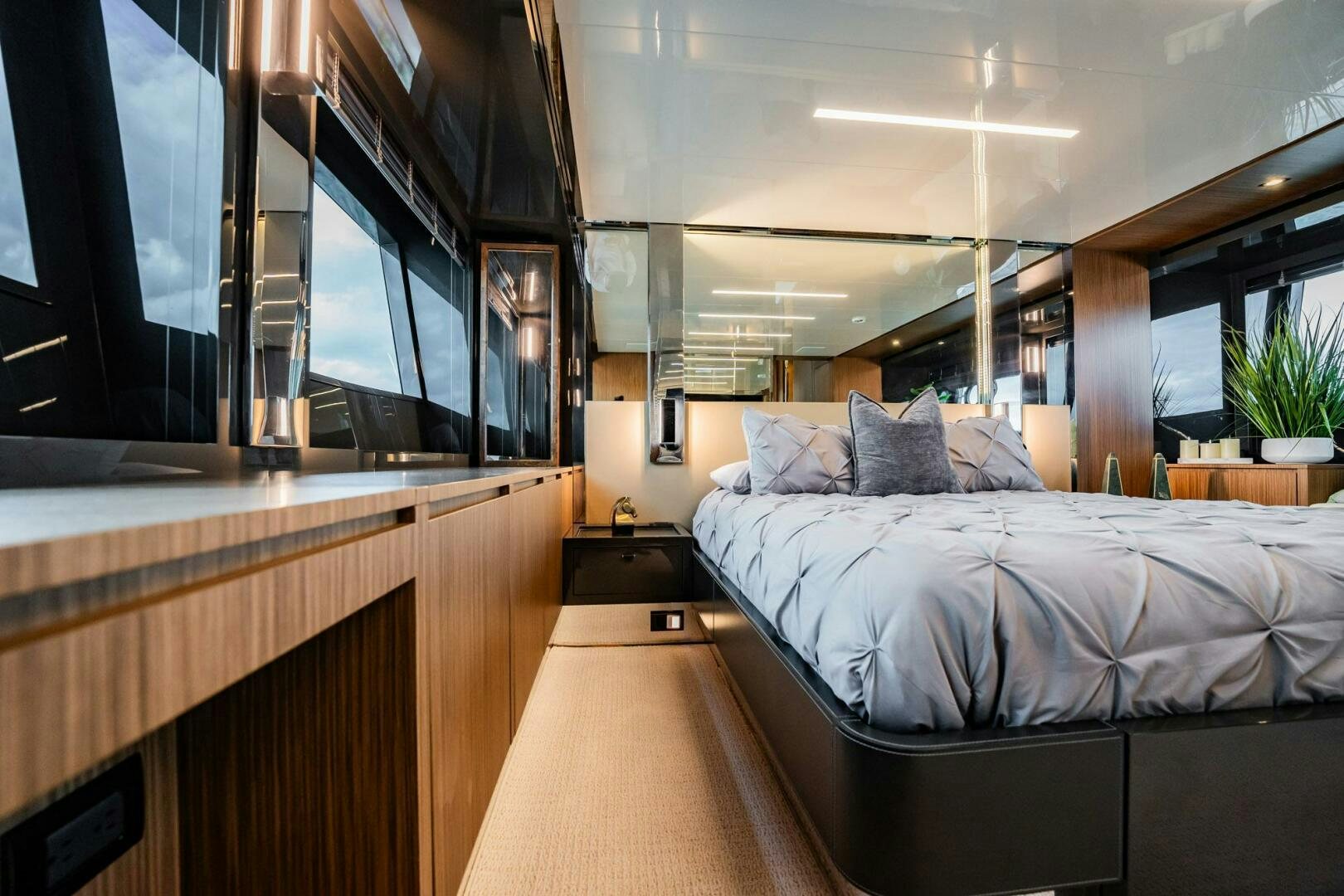 a room with a bed and a desk aboard RECREATIONAL USE Yacht for Sale