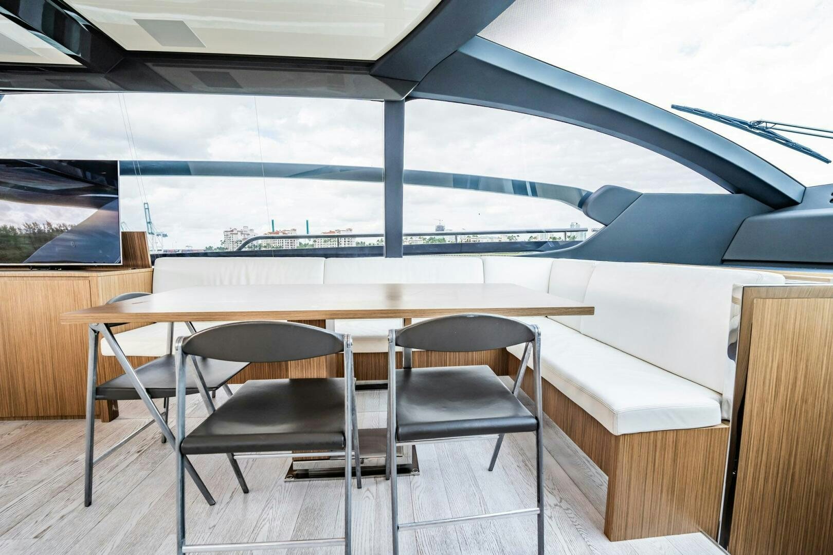 a room with a table and chairs aboard RECREATIONAL USE Yacht for Sale