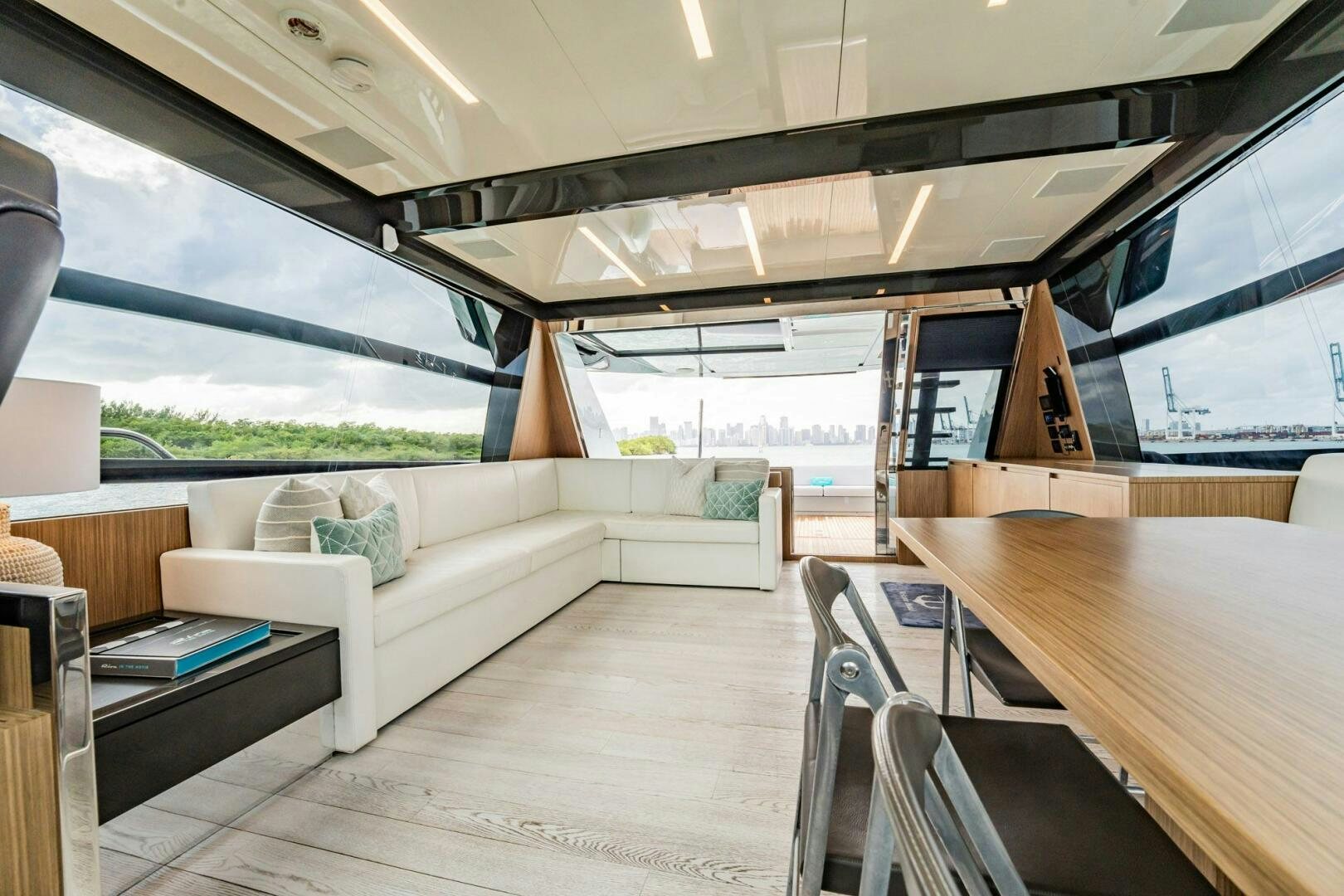 a room with a couch and a table aboard RECREATIONAL USE Yacht for Sale