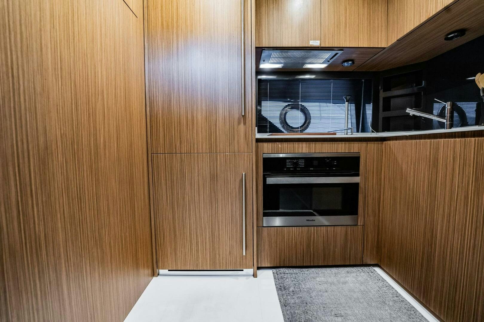 a microwave oven in a wooden cabinet aboard RECREATIONAL USE Yacht for Sale