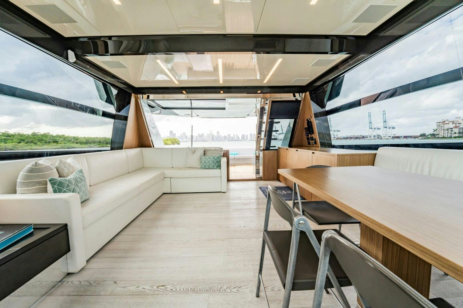 a room with a table and chairs aboard RECREATIONAL USE Yacht for Sale