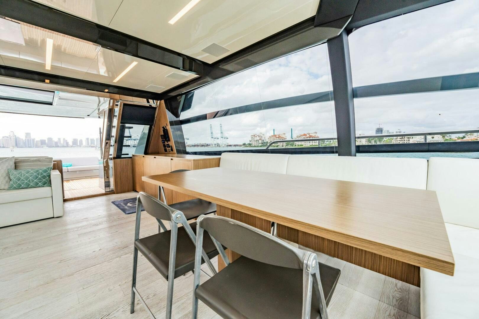 a room with a table and chairs aboard RECREATIONAL USE Yacht for Sale