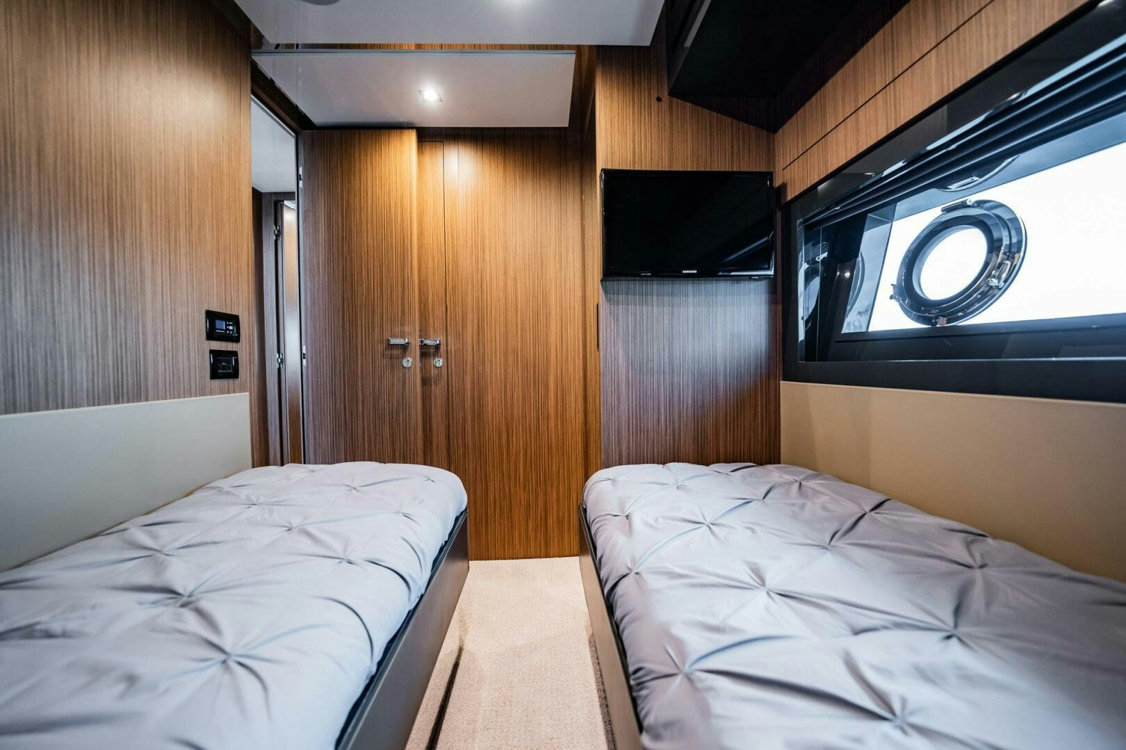 a room with a bed and a fan aboard RECREATIONAL USE Yacht for Sale