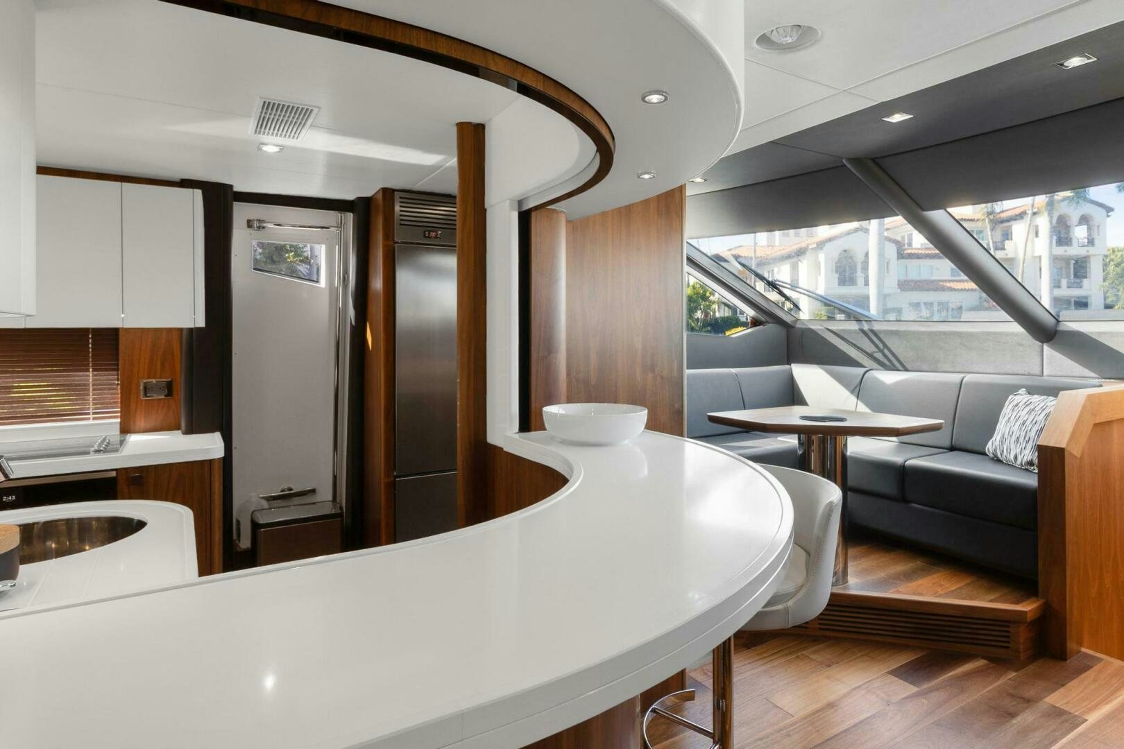 a modern looking kitchen with a large island aboard ALEXA Yacht for Sale