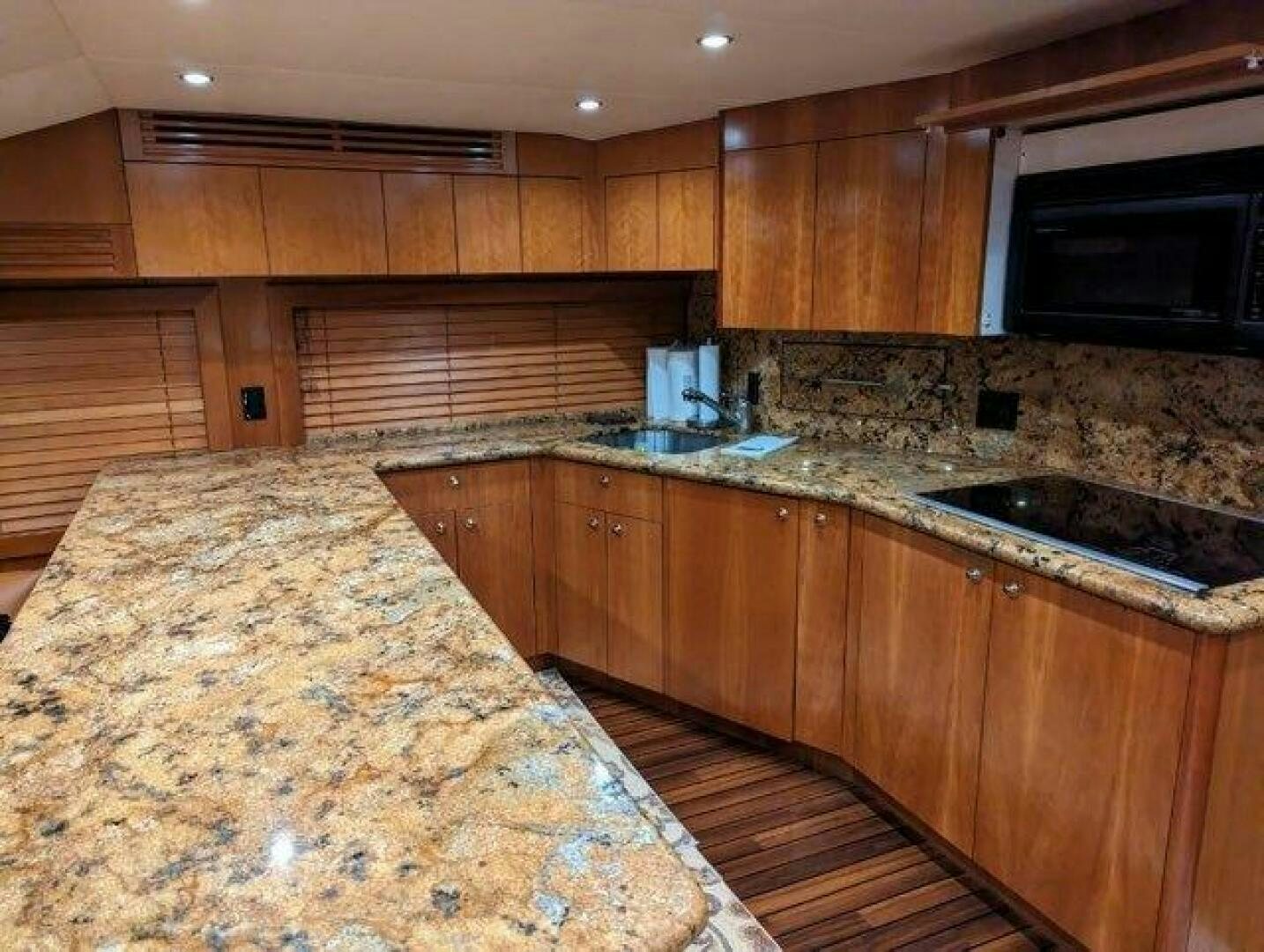 a kitchen with granite counter tops aboard BUZZ Yacht for Sale