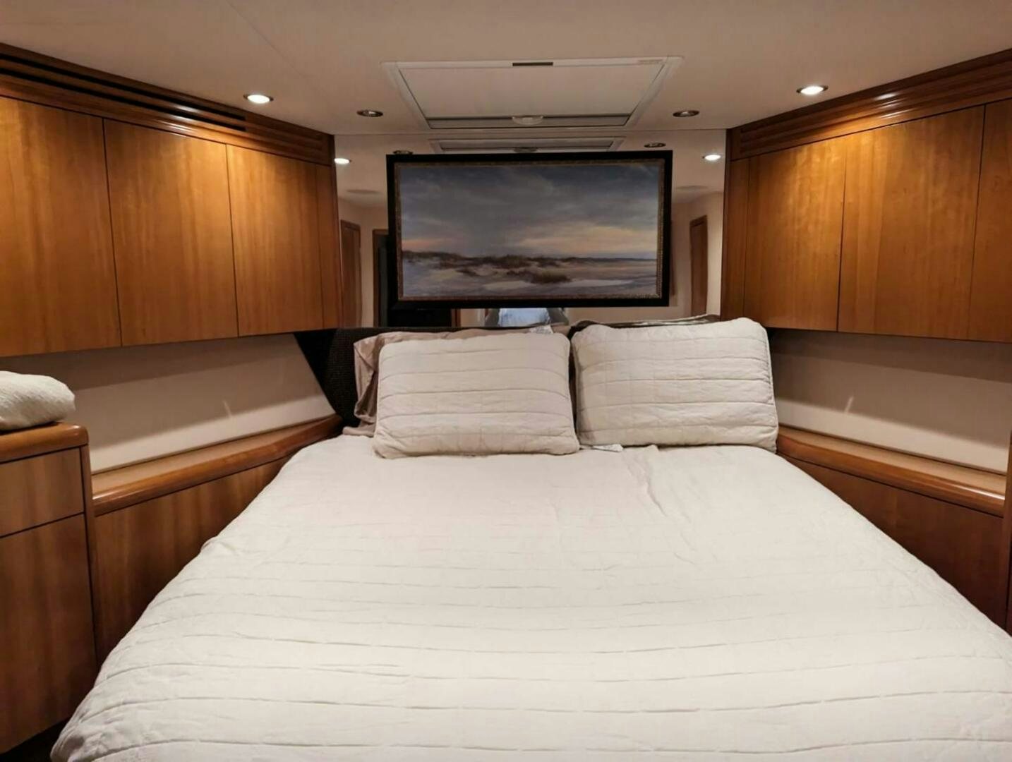 a bed with pillows aboard BUZZ Yacht for Sale