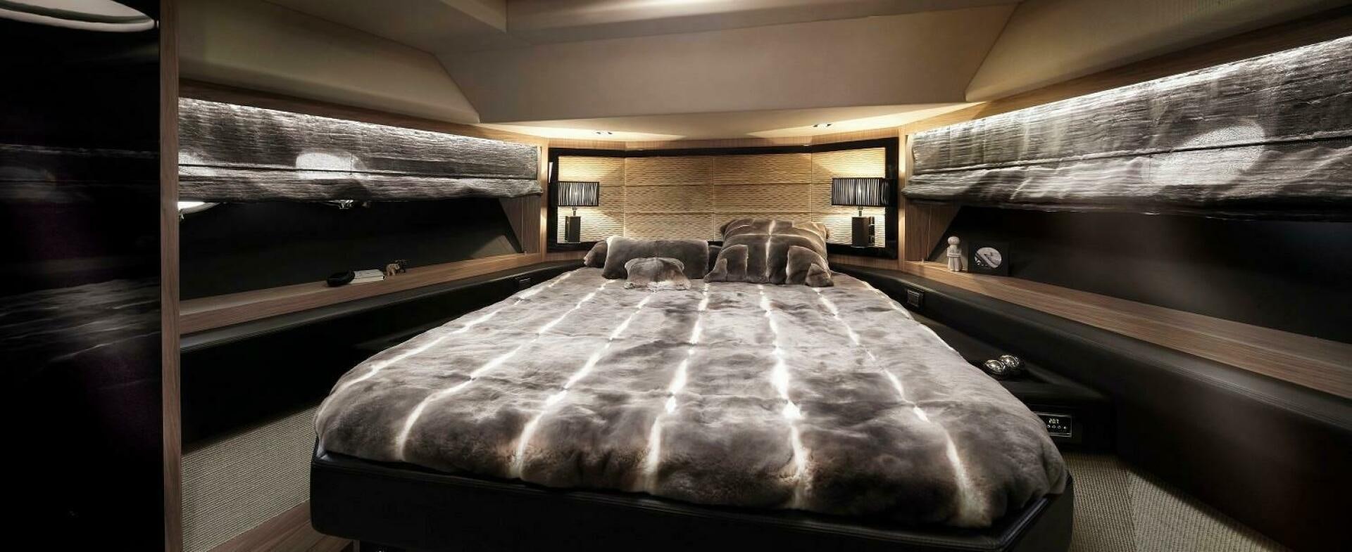 a room with a bed and a desk aboard C68 Yacht for Sale