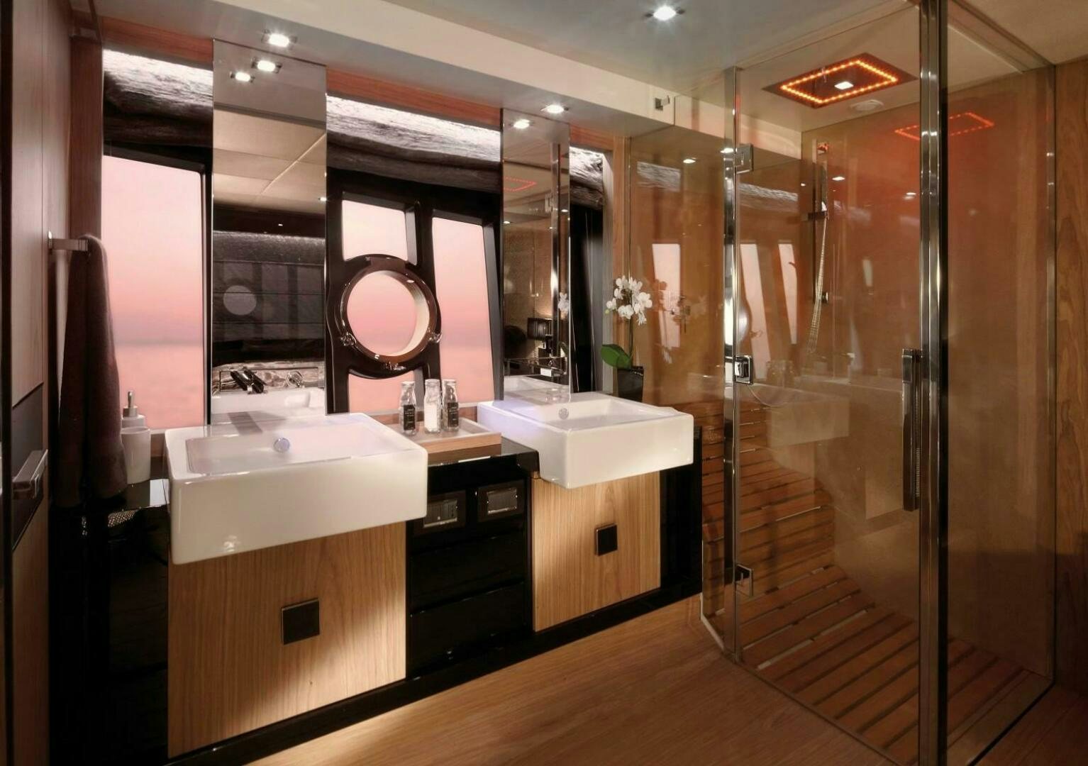 a bathroom with a large mirror aboard C68 Yacht for Sale