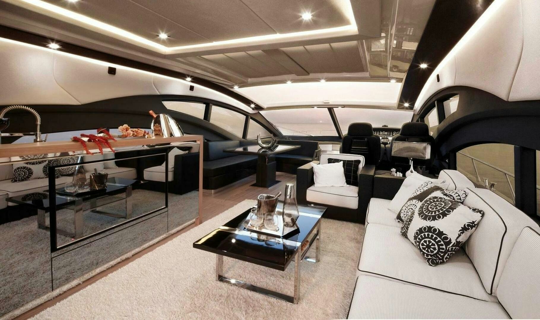 a room with a table and chairs aboard C68 Yacht for Sale