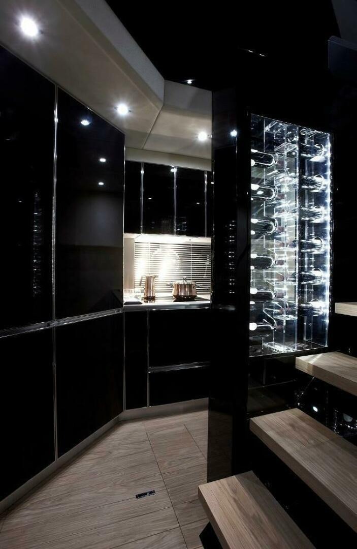 a room with a large glass window aboard C68 Yacht for Sale