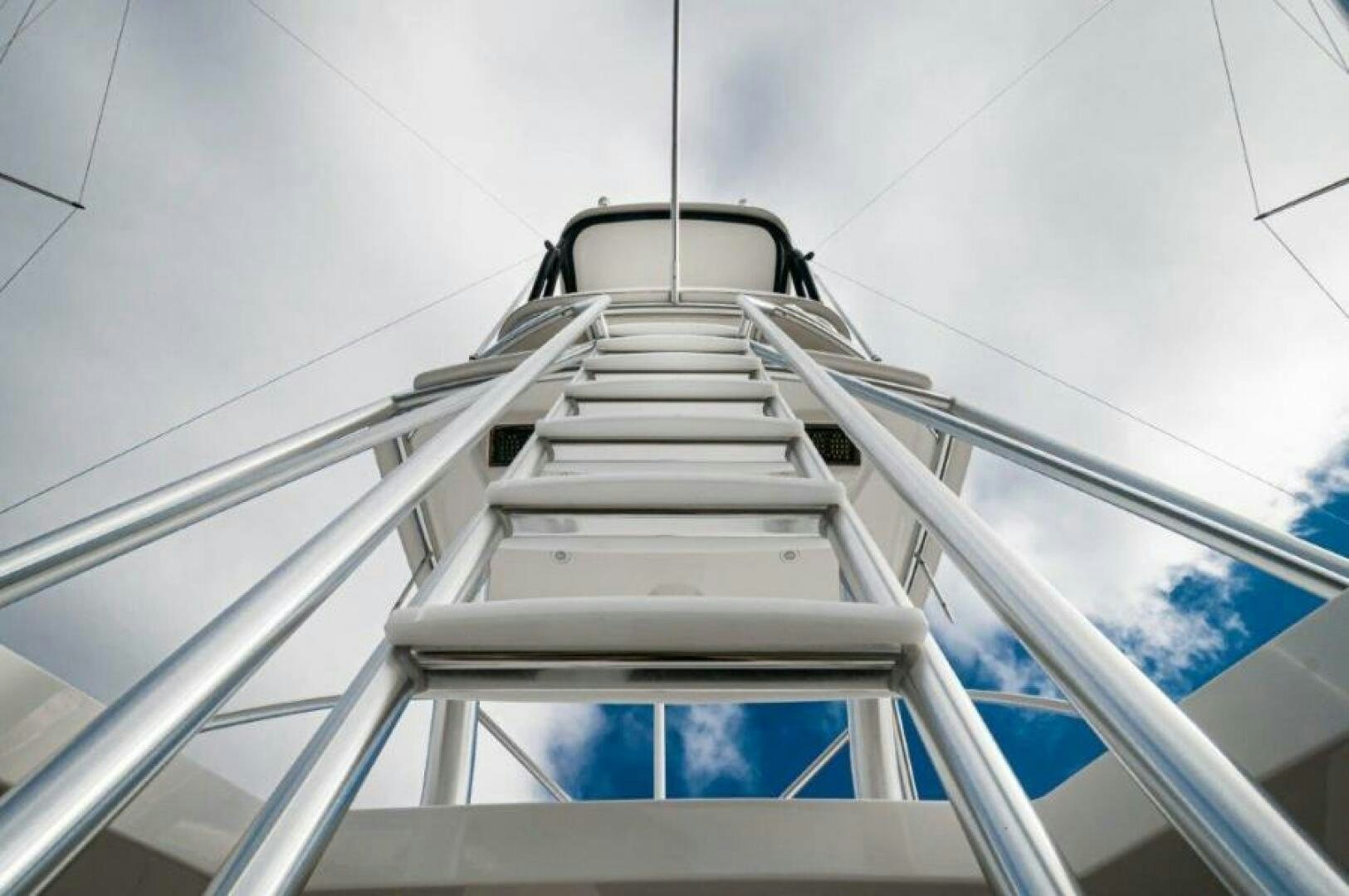 a white staircase with a metal railing aboard POUR INTENTIONS Yacht for Sale