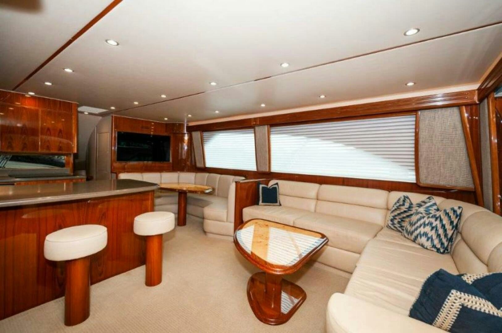 a living room with a couch and a table aboard POUR INTENTIONS Yacht for Sale