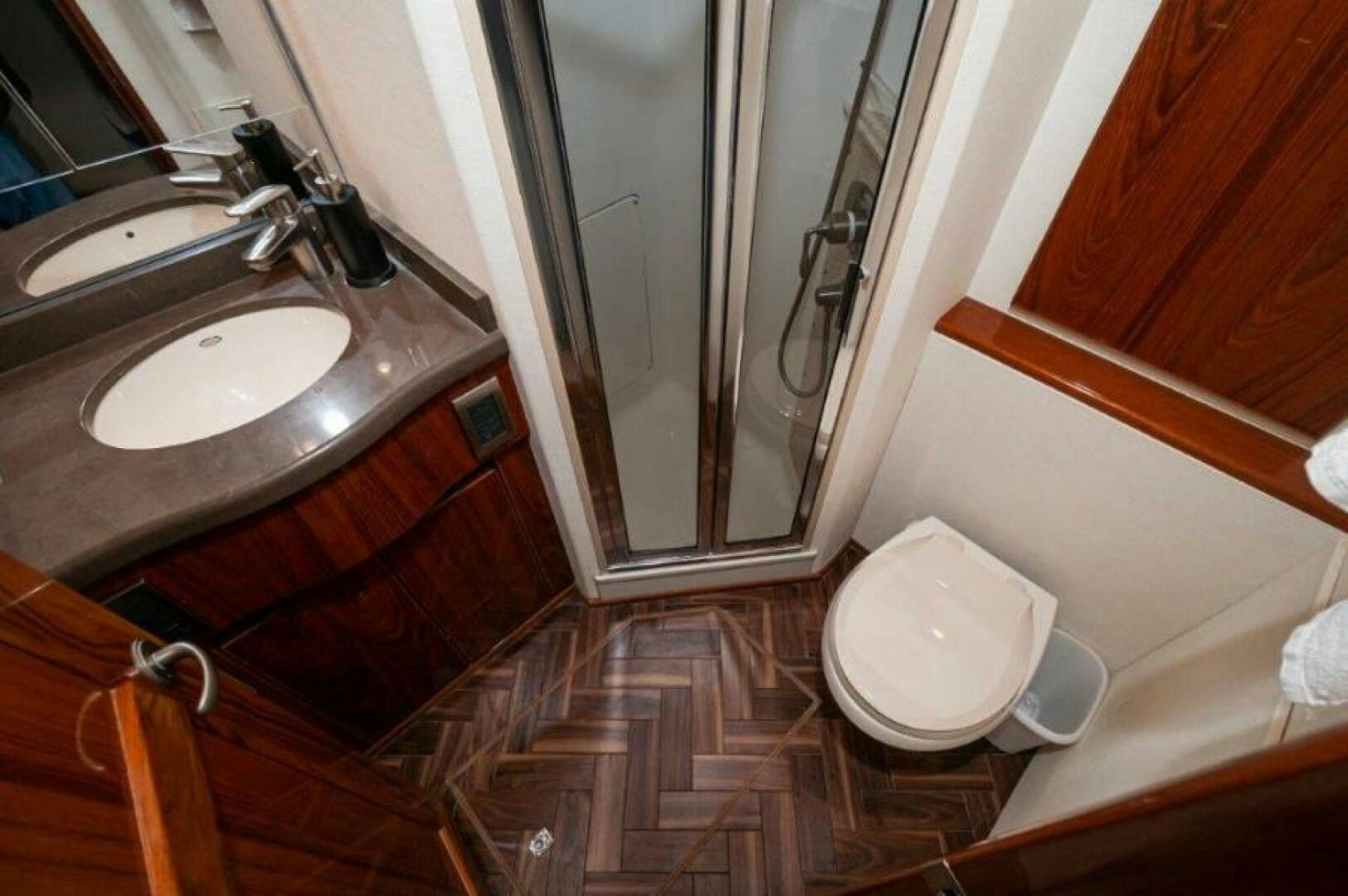 a bathroom with a sink and a toilet aboard POUR INTENTIONS Yacht for Sale