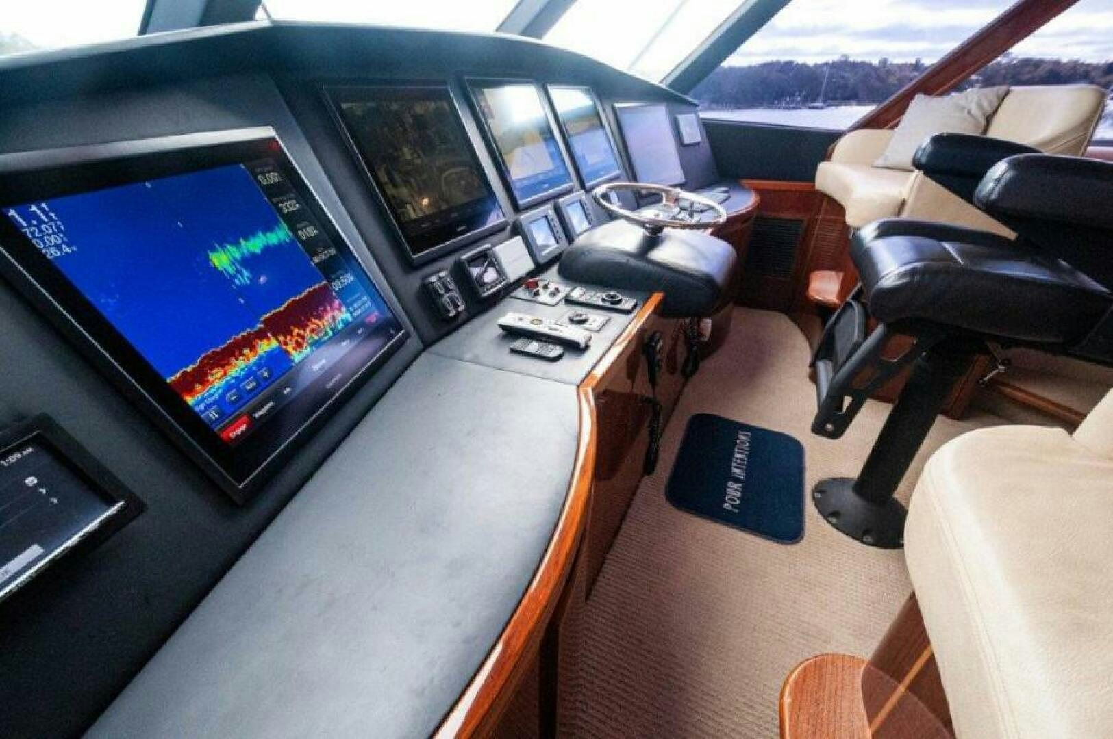 a car with a screen and a remote control on it aboard POUR INTENTIONS Yacht for Sale