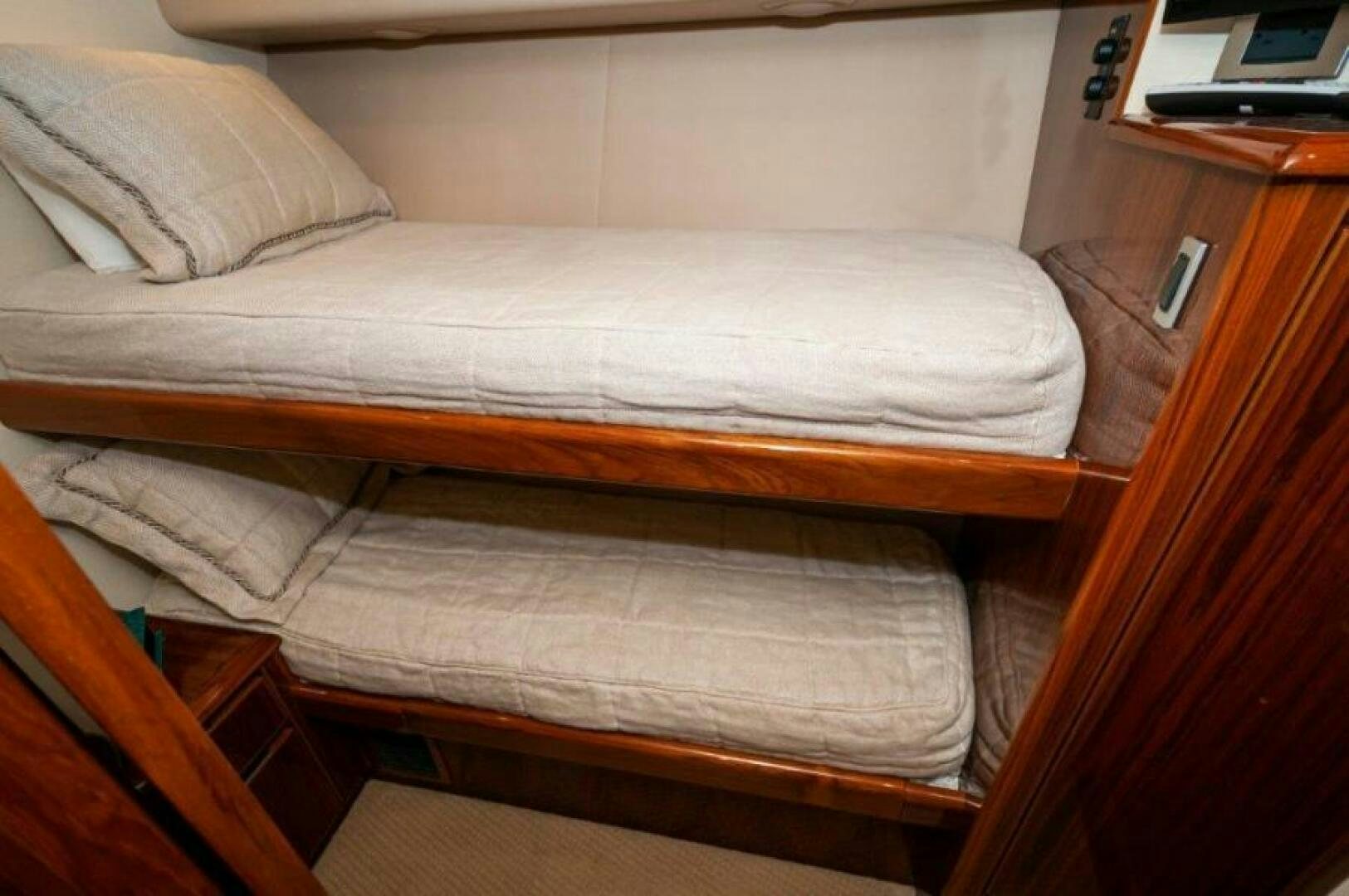 a bed with white sheets aboard POUR INTENTIONS Yacht for Sale