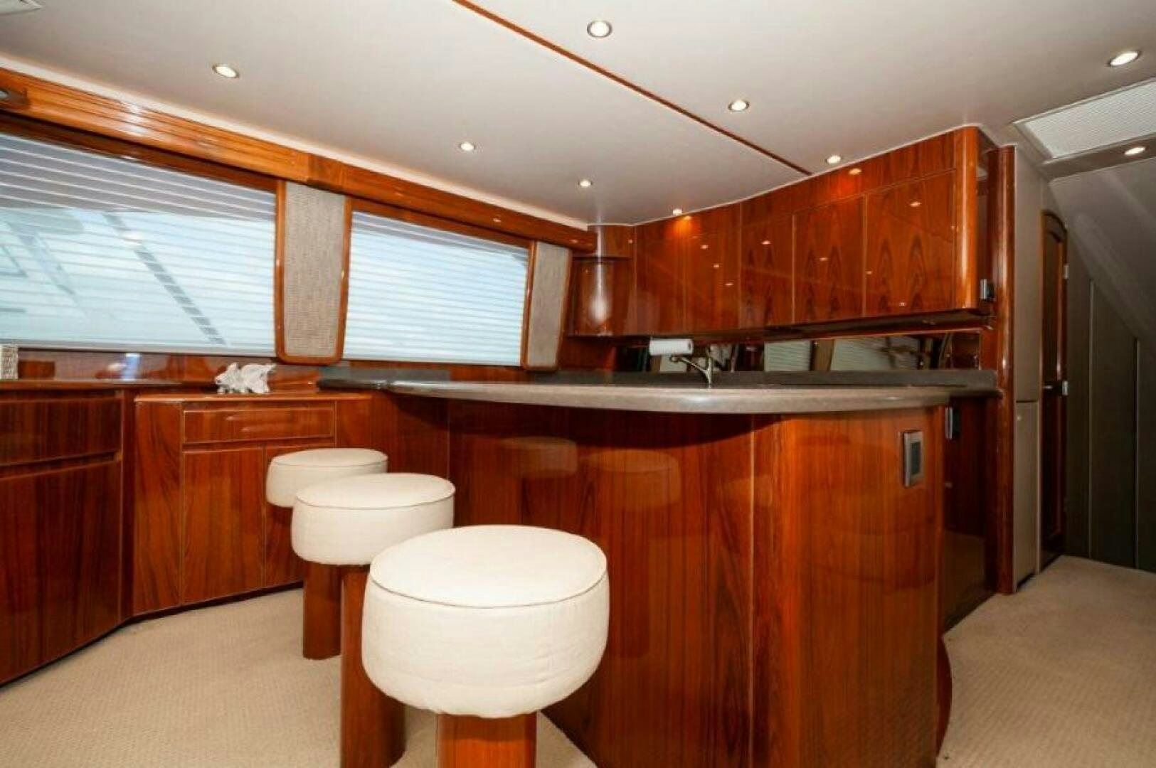 a kitchen with wooden cabinets aboard POUR INTENTIONS Yacht for Sale