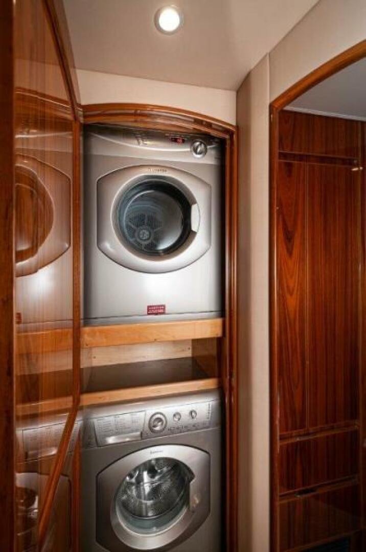 a washer and dryer in a closet aboard POUR INTENTIONS Yacht for Sale