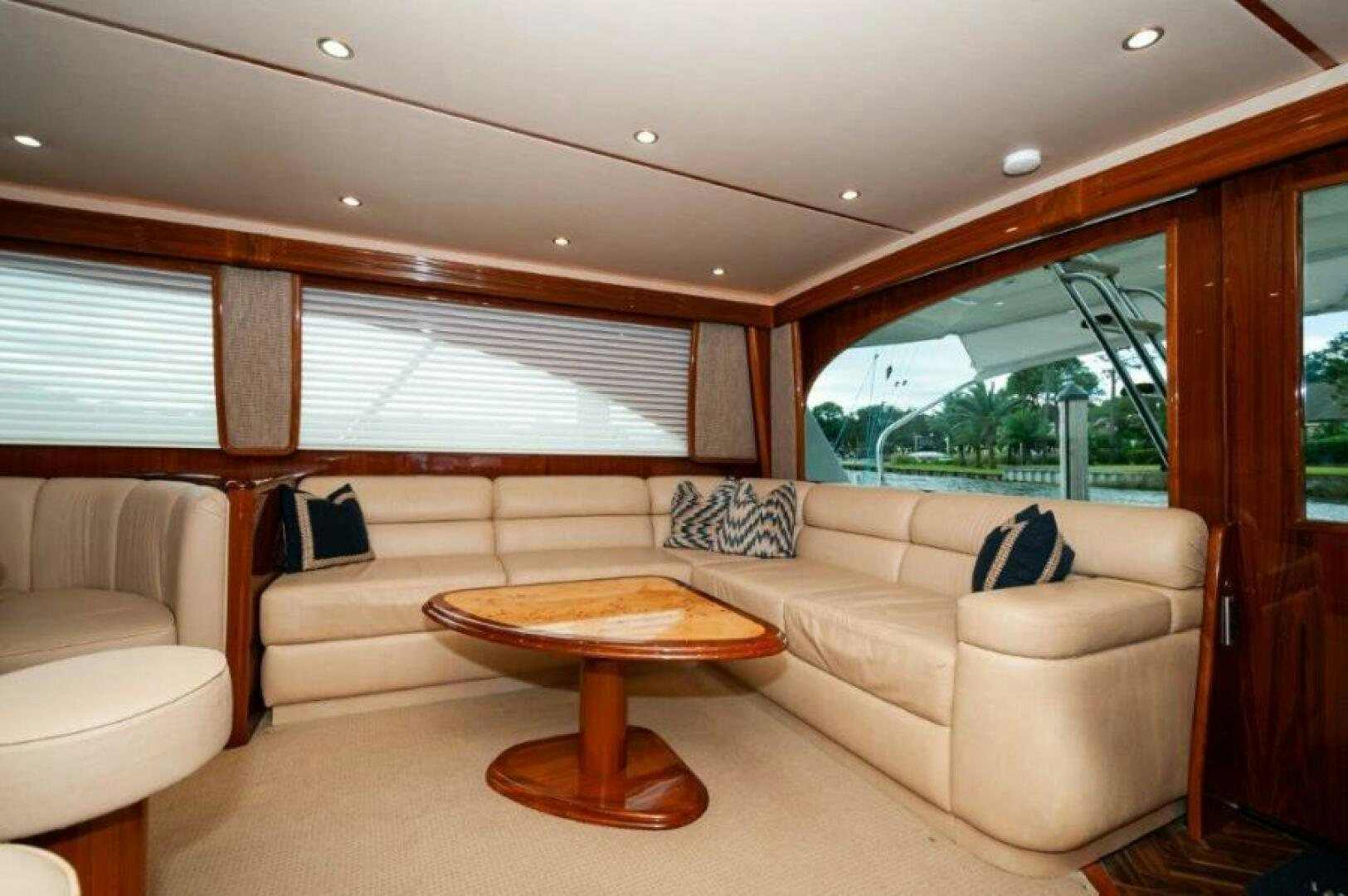 a living room with a couch and a table aboard POUR INTENTIONS Yacht for Sale