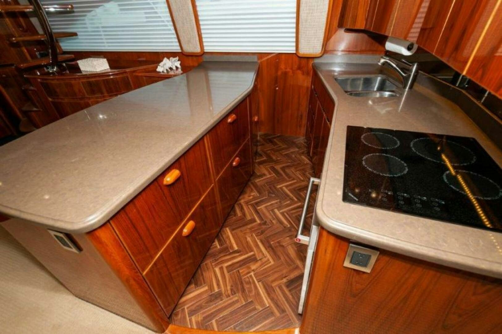 a kitchen with a stove and sink aboard POUR INTENTIONS Yacht for Sale