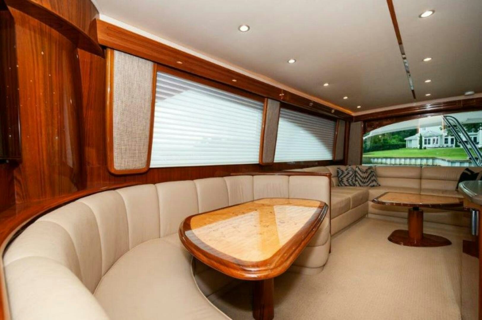 a living room with a couch and a table aboard POUR INTENTIONS Yacht for Sale