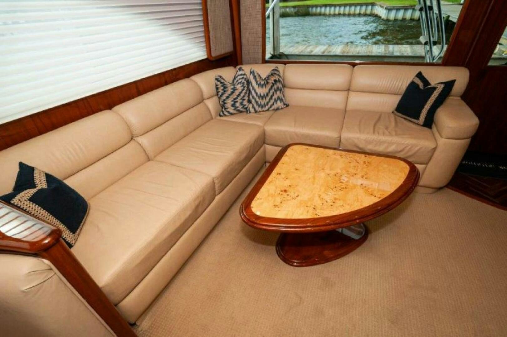 a couch with a pillow on it aboard POUR INTENTIONS Yacht for Sale