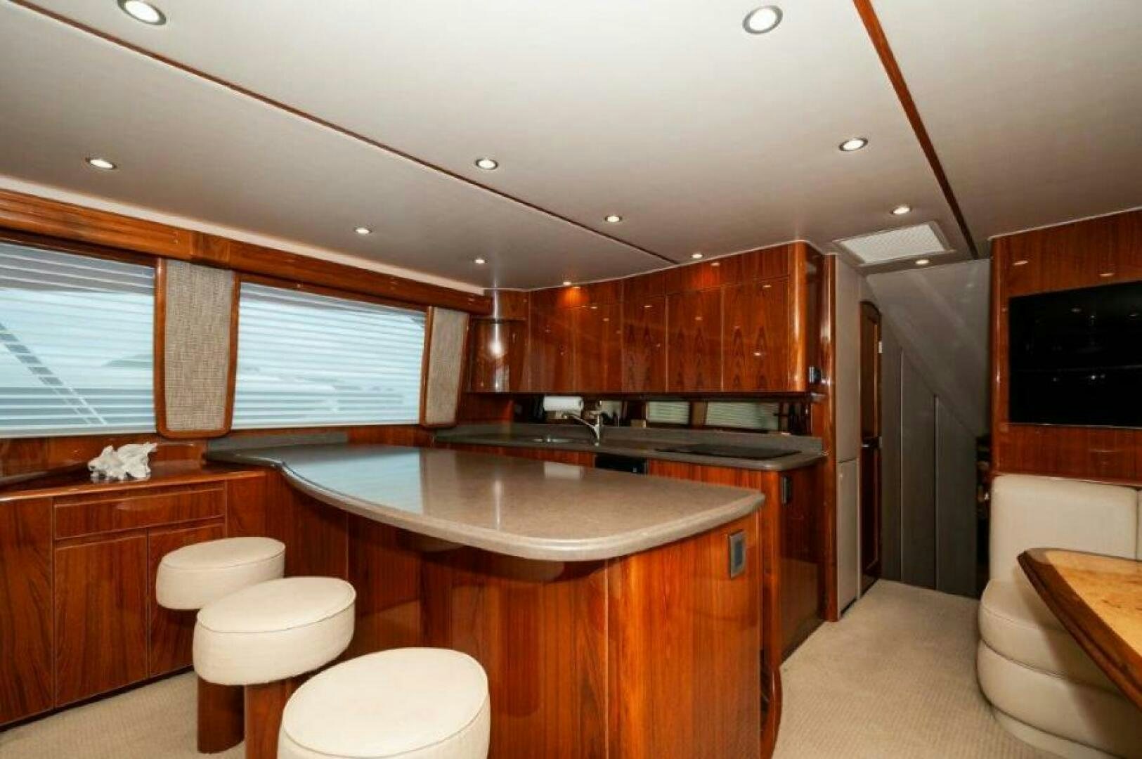 a kitchen with wooden cabinets aboard POUR INTENTIONS Yacht for Sale